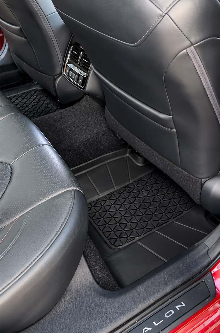 The same Avalon rear footwell, vacuumed clean with the mat restored
