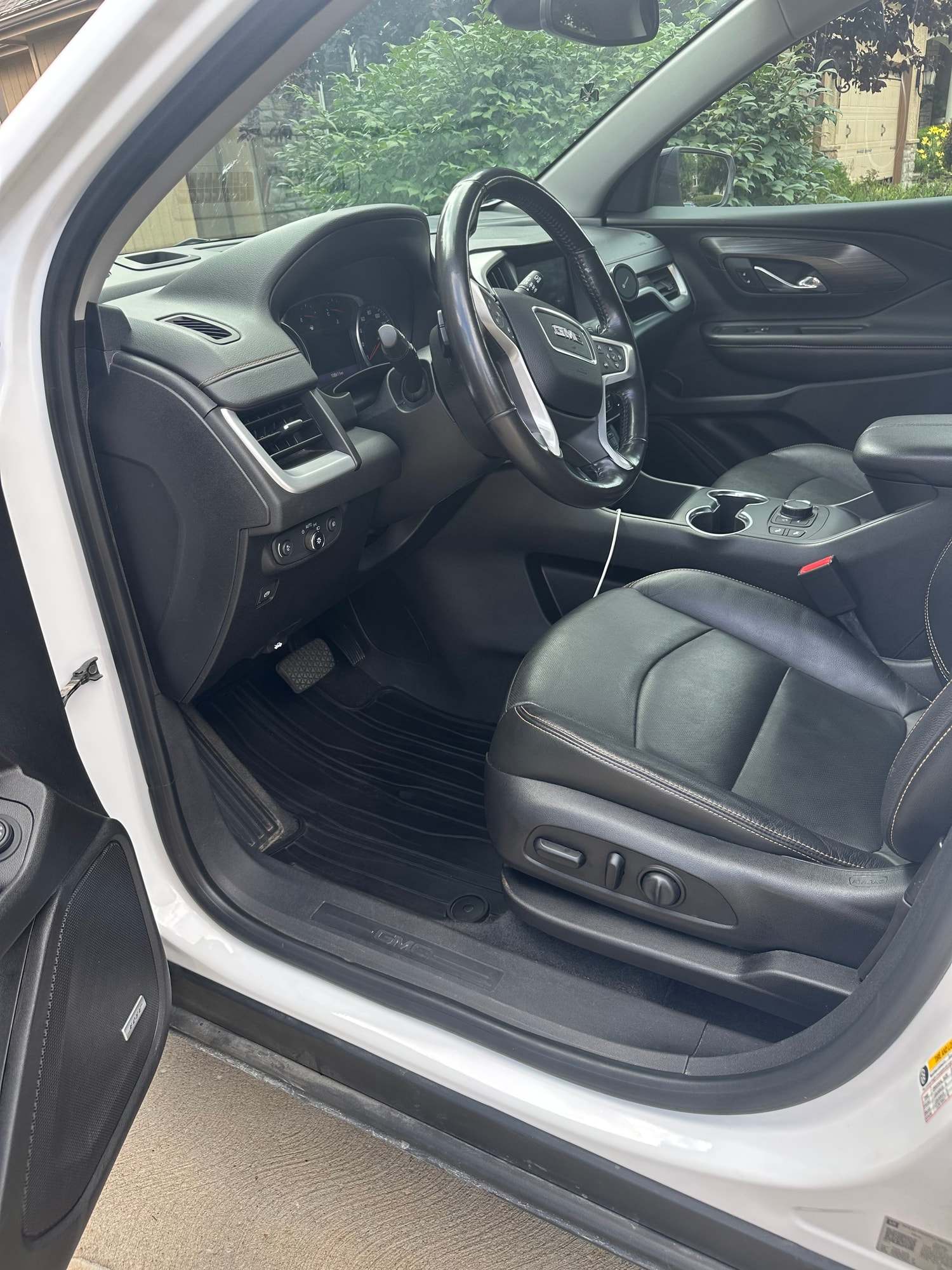 Black leather seats and center console inside a GMC
