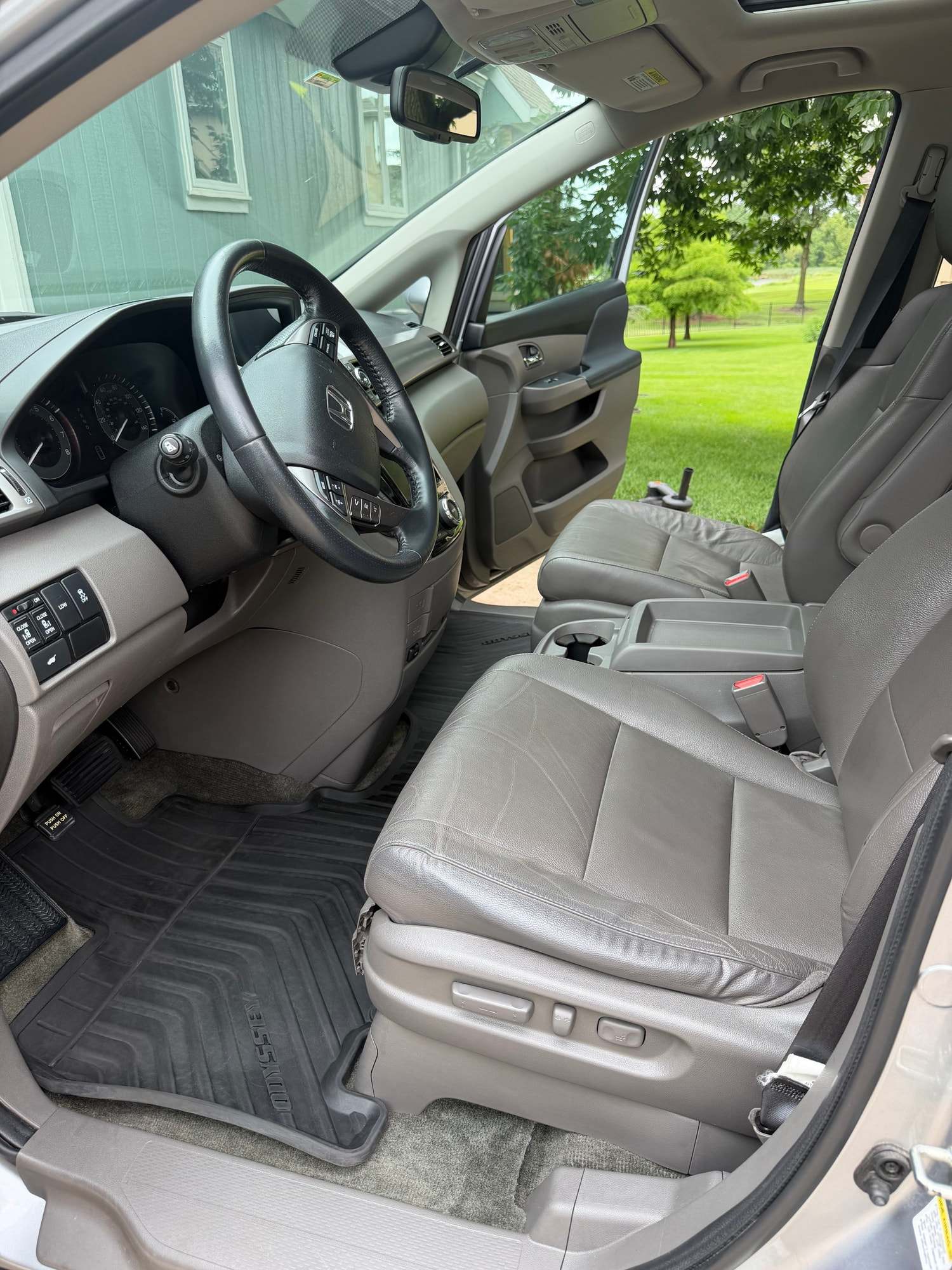 Gray cloth seats and dash inside a Honda