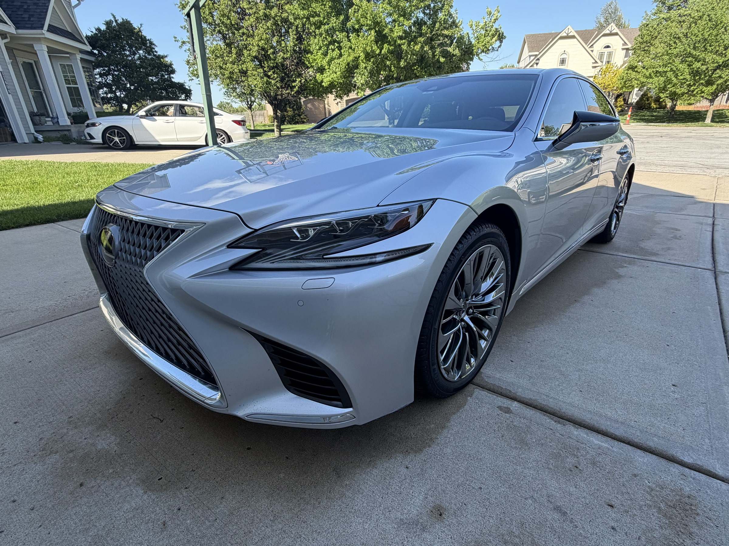 Silver Lexus LS sedan with fresh gloss on a residential driveway