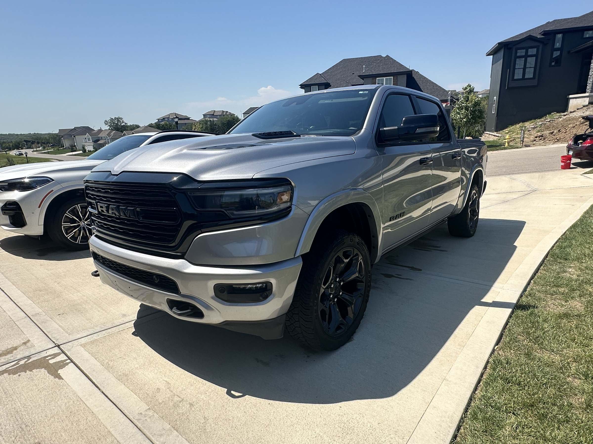 Gray Ram 1500 pickup on a concrete driveway after a Takumi detail