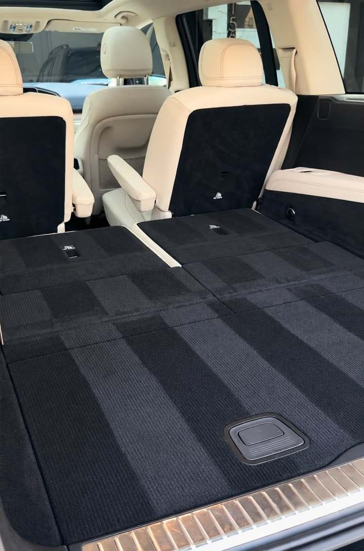 The same cargo area after a full vacuum, with clean carpet and fresh vacuum lines