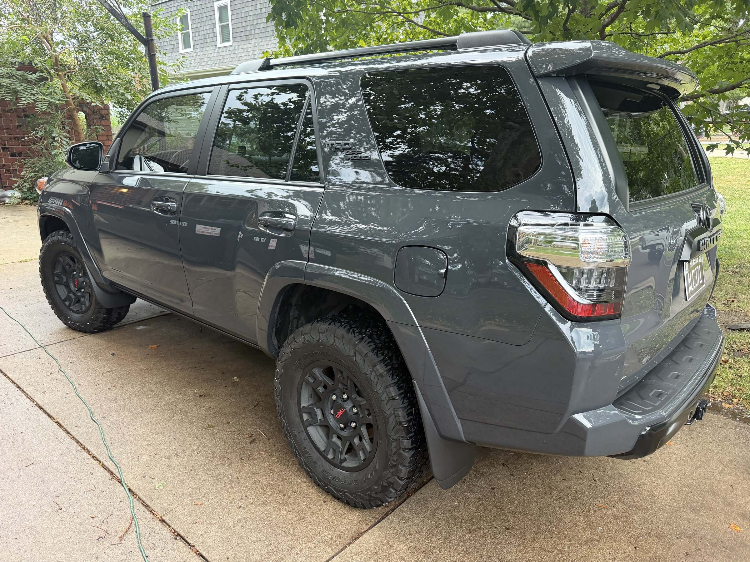 Gray Toyota 4Runner on a driveway after a Takumi detail