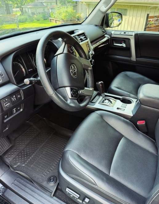Driver seat and dash of a Toyota 4Runner with black leather