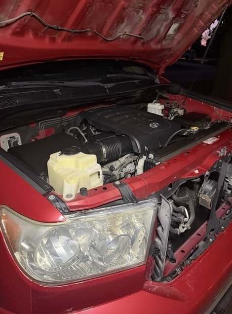 The same Tundra with a clear headlight and a cleaned engine bay