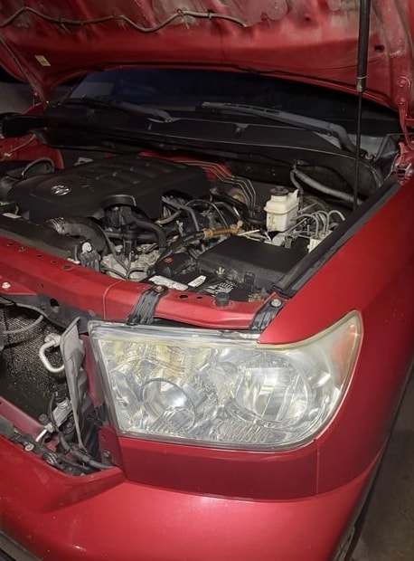 Second angle of the red Tundra after restoration, with a clear headlight